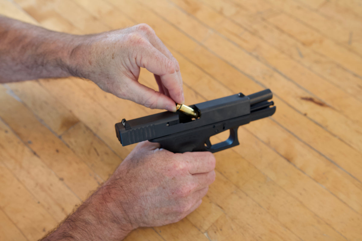 Loading an iTarget laser bullet into a handgun chamber
