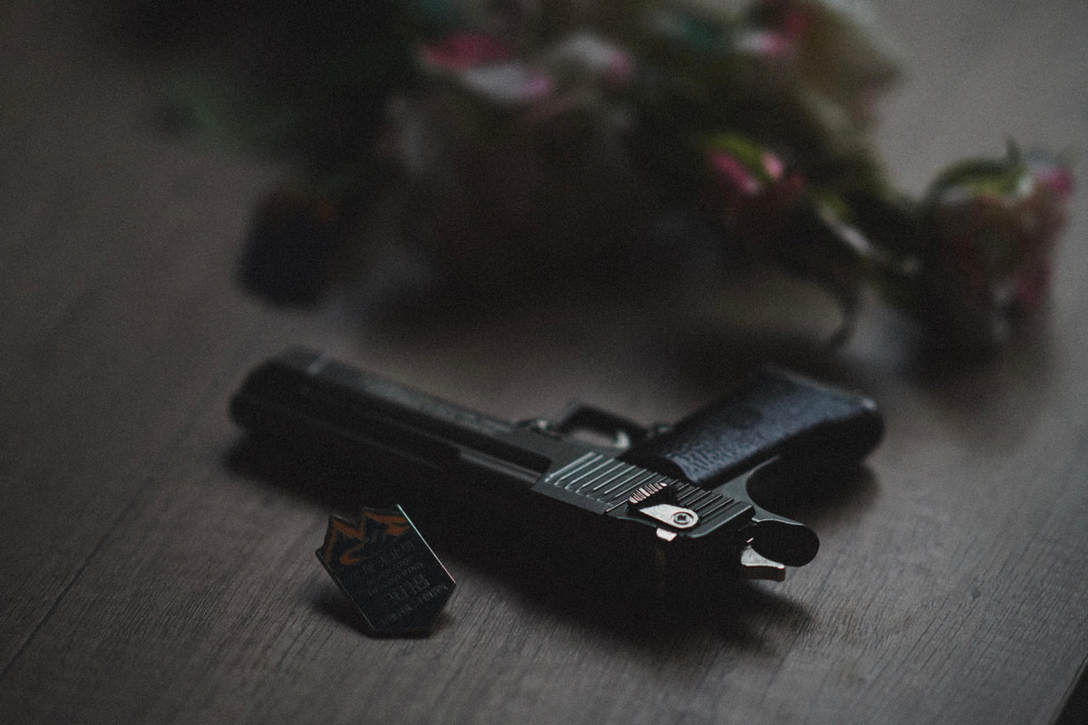 Handgun resting on a dark table